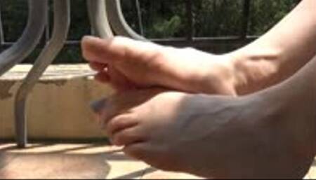 Christine on a balcony wiggles her small feet_part 2