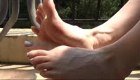 Christine wiggles her small feet on a balcony_part 2