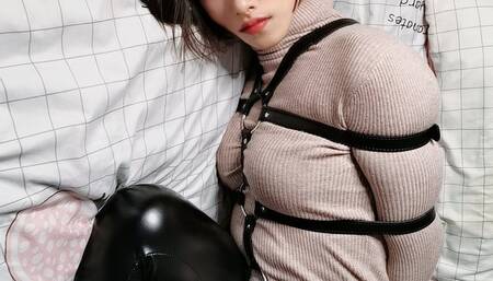 Sweater, leather pants, leather bondage