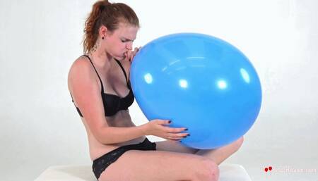 Kristina inflates a huge blue balloon (HD)