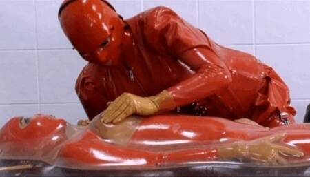 Rubber vac-bed breath play session with two latex piss lesbians - Part 1 of 2