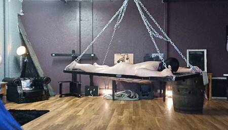 Flogged on a dungeon hammock