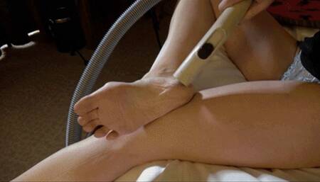 Hotelmaid Karina vacuums her feet