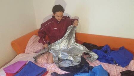 Nadin sorts her many nylon jackets and puts them on - Part 1 - 100