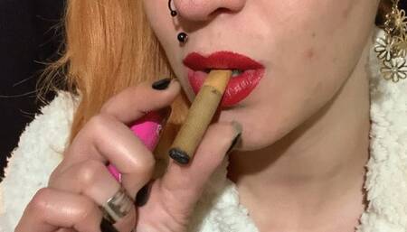 Smoking and inhaling cigarillos