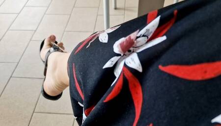 Sexy dangling expansive sandals in a public bar 4K