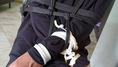 Sofi tied to a chair with black and white ropes_Gelen_Tel