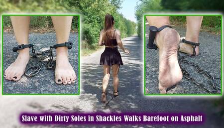 Slave with Dirty Soles in Shackles Walks Barefoot on Asphalt - Bondage - Shackles - Foot fetish - Peeping - Woman training - Chains - Clinking chains on asphalt - Walking barefoot in the forest - Muscular calves - Short skirt - Foot worship - Dirty soles