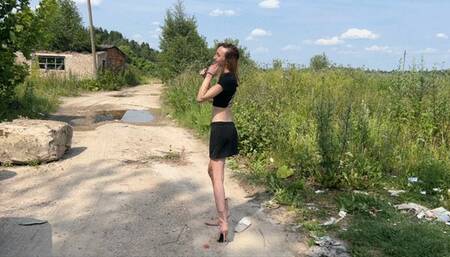 a girl in new high-heeled boots walks through deep puddles, water is poured into the boots