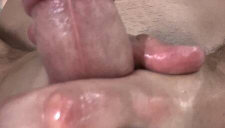 Oily masturbation with a cum shot