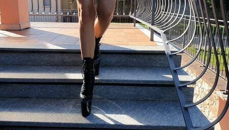 Sprain in very high 8 inch pleaser heels black boots