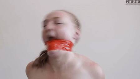 Captured Kerry hard and tough tae wraparound gag, naked on bed trying to escape