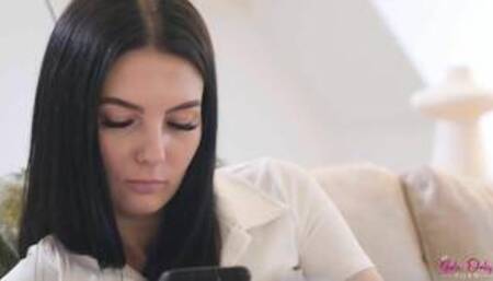 Simon Kitty and Adrianna on a grey coloured sofa in a lesbian scene together