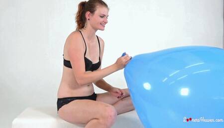 Kristina inflates a huge blue balloon (MOBILE)