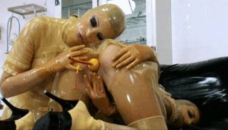 Transparent latex fetish lesbian peeing girls and pussy stretching treatment - Part 2 of 2