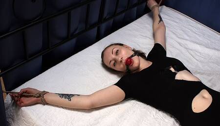Ballgagged barefoot Amanda in ripped black leotard, bound on the bed with her hands and feet wide-spread, wiggles on the bed (HD MOV)
