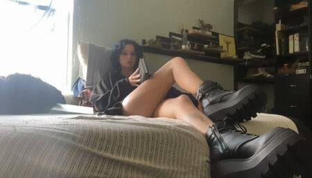Maeve ignores you with her boots and a book