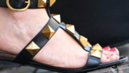 Near her beautiful feet, you can smell the leather of her shoes