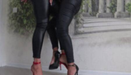 Flirting beautiful legs in leather pants and sandals JII