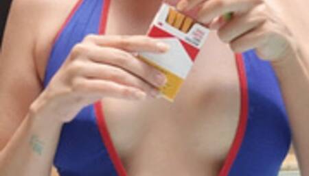 Naughty Smoking cork cigarette in a swimsuit by the pool