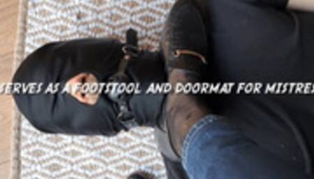 Slave serves as a footstool and doormat for Mistress Cola