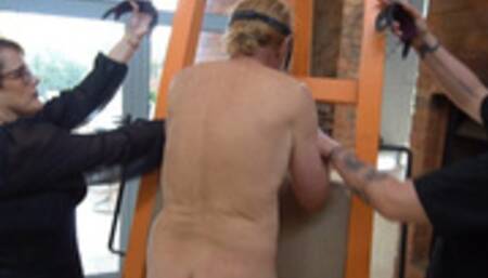 Preparation for a caning with Mistress Baton and Mistress Lady Fire caning