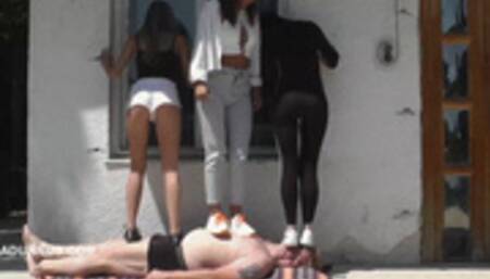 Mistresses trample the slave on the terrace wmv