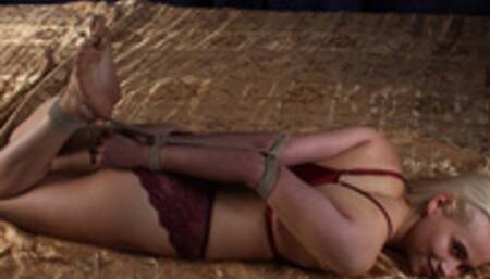Thelma: barefoot blonde girl in red bra and panties, hogtied with her elbows tightly bound together, rolls on the bed and gets tickled by camera man (HD WMV)