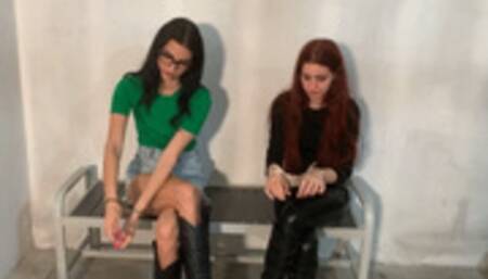 Charlotte in maximum security handcuffs and tube