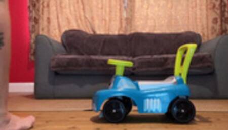 Giantess Riding On A Ride-On Toy Car