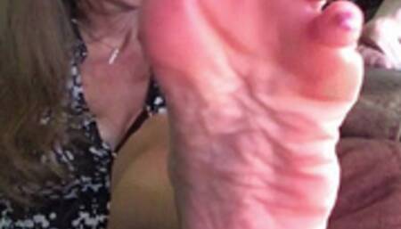 WRINKLED SOLES REST ON SOFA