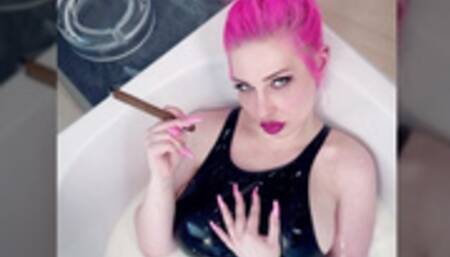 Smoking cigar in milk bath wearing PVC swimsuit