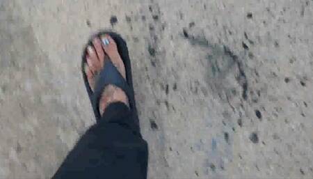 Avi Lola walks in flip flops wiggling her toes and crushing random things in her path