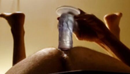 Guy has an anal dildo quickie using a big thick dildo and showing feet