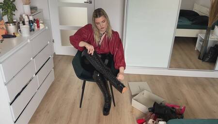 Woman in leather clothes show her boots and heels collection