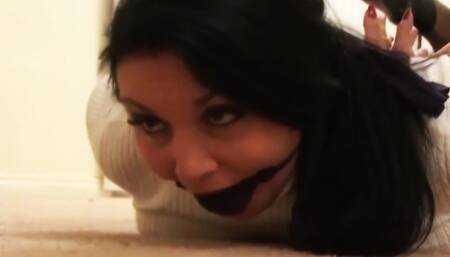 Gina Rae hogtied with palms facing out and gagged with a big ball inside a stocking!