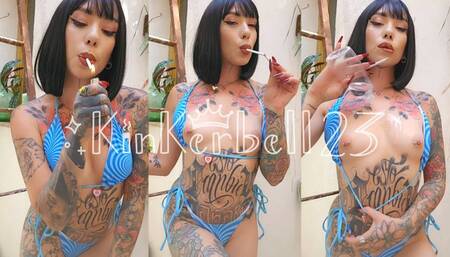 Chain-smoking with oil and breast play in cute Blue bikini