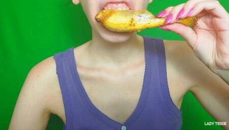 chewing and eating a chicken leg