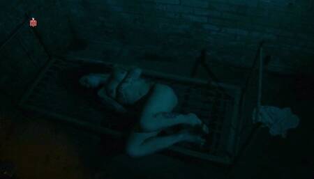 Tattoo-Girl bound to a bedframe to feel tickling, clamps and bastonade