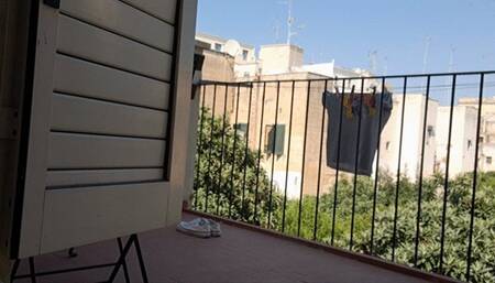 NAKED ON THE BALCONY