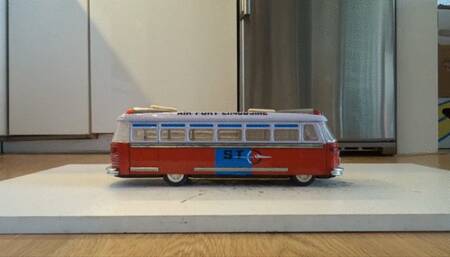 Well worn Nike AirForce 1 (AF1) stomp, crush and destroy vintage tin model car bus