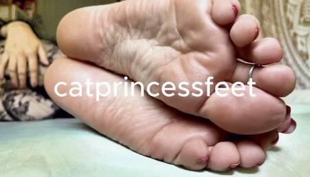 Lace and wrinkly, lotioned soles tease, red toes