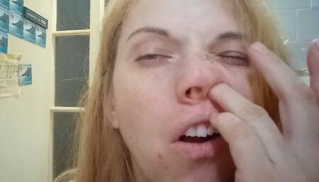 A booger hunter looking for treasure in his nose