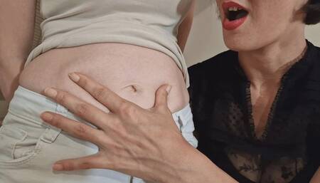 A petite woman with a huge belly button