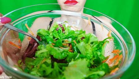 chewing and eating colorful salad