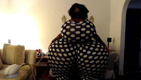 Breast and butt inflation in polka dot jumpsuit