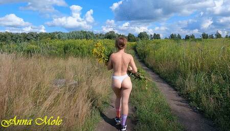 Walking in nature topless, beauty with a juicy ass and a beautiful figure walks naked in nature in only panties