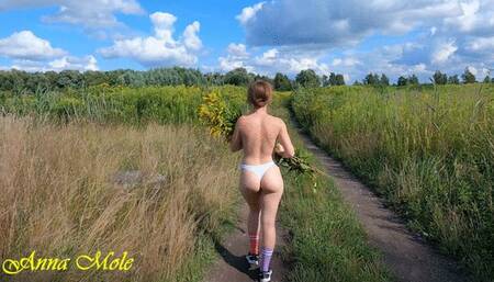 Walking in nature topless, beauty with a juicy ass and a beautiful figure walks naked in nature in only panties