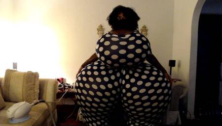 Breast and butt inflation in polka dot jumpsuit