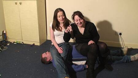 2 Girls Sit On The Slave